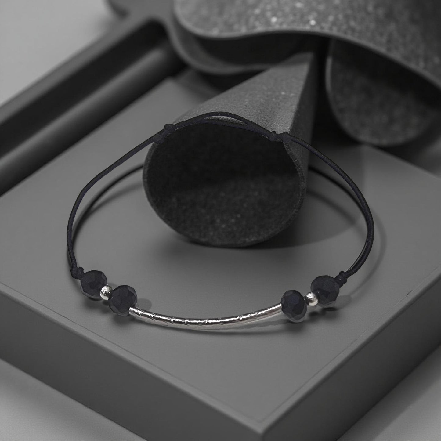 Black Crystal and Curved Silver-Tone Tube Cord Bracelet Code: BRC002